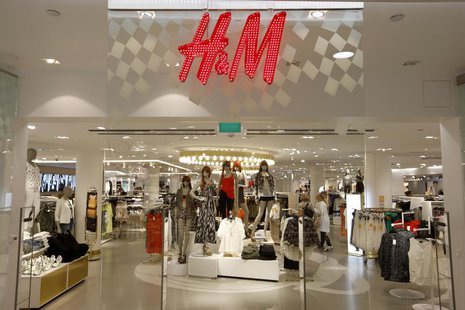 The company logo is placed at the flagship store of H&M, Hennes & Mauritz, HMb.ST, the world's second-biggest fashion retailer in Sweden's c The company logo is placed at the flagship store of H&M, Hennes & Mauritz, HMb.ST, the world's second-biggest fashion retailer in Sweden's c