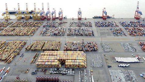 Cars and containers are pictured at a shipping terminal in the harbour of the German northern town of Bremerhaven, late October 8, 2012. REU Cars and containers are pictured at a shipping terminal in the harbour of the German northern town of Bremerhaven, late October 8, 2012. REU