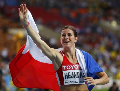 Zuzana Hejnova of Czech Republic waves as she celebrates winning the women's 400 meters hurdles final during the IAAF World Athletics Champi Zuzana Hejnova of Czech Republic waves as she celebrates winning the women's 400 meters hurdles final during the IAAF World Athletics Champi