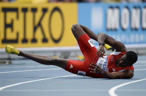 Jehue Gordon of Trinidad And Tobago falls onto the track after crossing the finish line to win the men's 400 metres hurdles final during the Jehue Gordon of Trinidad And Tobago falls onto the track after crossing the finish line to win the men's 400 metres hurdles final during the