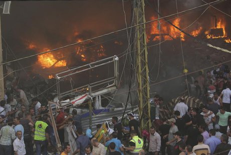 Cars burn at the site of an explosion in Beirut's southern suburbs, August 15, 2013. REUTERS/Mahmoud Kheir Cars burn at the site of an explosion in Beirut's southern suburbs, August 15, 2013. REUTERS/Mahmoud Kheir