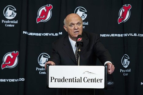 New Jersey Devils general manager Lou Lamoriello speaks to the media while he attends an NHL hockey news conference announcing the new owner New Jersey Devils general manager Lou Lamoriello speaks to the media while he attends an NHL hockey news conference announcing the new owner