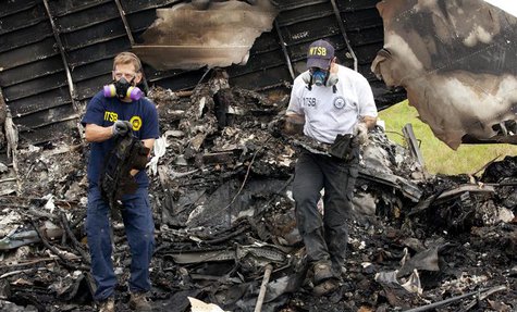 National Transportation Safety Board (NTSB) investigators retrieve the flight voice and data recorders from the wreckage of UPS flight 1354 National Transportation Safety Board (NTSB) investigators retrieve the flight voice and data recorders from the wreckage of UPS flight 1354