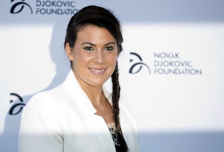 French tennis player Marion Bartoli poses for photographers as she arrives at a fundraising dinner for the Novak Djokovic Foundation in Lond French tennis player Marion Bartoli poses for photographers as she arrives at a fundraising dinner for the Novak Djokovic Foundation in Lond