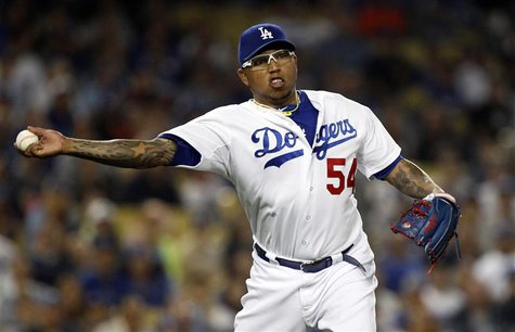 Los Angeles Dodgers relief pitcher Ronald Belisario throws out New York Mets' Juan Lagares (not pictured) on a ground ball in the eighth inn Los Angeles Dodgers relief pitcher Ronald Belisario throws out New York Mets' Juan Lagares (not pictured) on a ground ball in the eighth inn