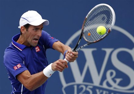 Novak Djokovic of Serbia hits a return to David Goffin of Belgium during their men's singles match at the Cincinnati Open tennis tournament Novak Djokovic of Serbia hits a return to David Goffin of Belgium during their men's singles match at the Cincinnati Open tennis tournament