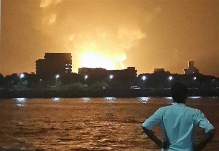 A man watches Indian Navy submarine INS Sindhurakshak on fire in Mumbai late August 13, 2013. REUTERS/Vikalp Shah A man watches Indian Navy submarine INS Sindhurakshak on fire in Mumbai late August 13, 2013. REUTERS/Vikalp Shah