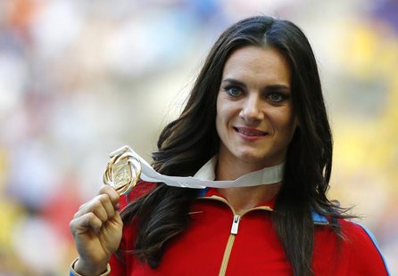 Gold medallist Yelena Isinbayeva of Russia holds her medal at the women's pole vault victory ceremony during the IAAF World Athletics Champi Gold medallist Yelena Isinbayeva of Russia holds her medal at the women's pole vault victory ceremony during the IAAF World Athletics Champi