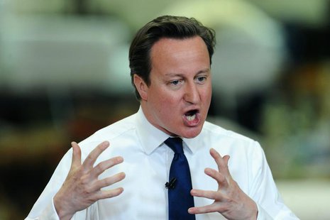 Britain's Prime Minister David Cameron answers questions asked by workers at an upholstery factory in Long Eaton, central England April 22, Britain's Prime Minister David Cameron answers questions asked by workers at an upholstery factory in Long Eaton, central England April 22,