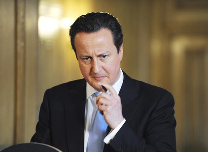 Britain's Prime Minister David Cameron listens to a question during a news conference at Number 10 Downing Street in London March 14, 2013. Britain's Prime Minister David Cameron listens to a question during a news conference at Number 10 Downing Street in London March 14, 2013.