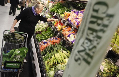 A shopper looks through the produce section in a newly opened Walmart Neighborhood Market in Chicago, September 21, 2011. REUTERS/Jim Young A shopper looks through the produce section in a newly opened Walmart Neighborhood Market in Chicago, September 21, 2011. REUTERS/Jim Young