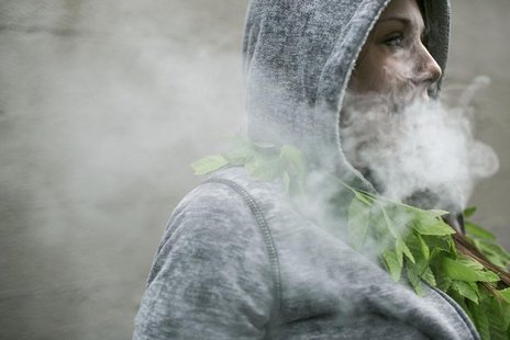 Mary Becker, 21, of Boise, Idaho exhales after taking a hit of hash oil at during 420Fest at the Luxe Nightclub in Seattle, Washington April Mary Becker, 21, of Boise, Idaho exhales after taking a hit of hash oil at during 420Fest at the Luxe Nightclub in Seattle, Washington April