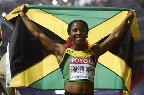Shelly-Ann Fraser-Pryce of Jamaica holds her national flag as she celebrates winning the women's 200 metres final during the IAAF World Athl Shelly-Ann Fraser-Pryce of Jamaica holds her national flag as she celebrates winning the women's 200 metres final during the IAAF World Athl
