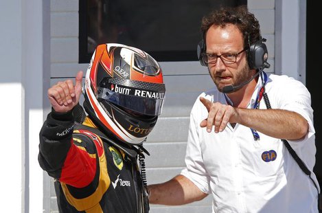 Lotus F1 Formula One driver Kimi Raikkonen of Finland gives a thumbs-up after placing second in the Hungarian F1 Grand Prix at the Hungarori Lotus F1 Formula One driver Kimi Raikkonen of Finland gives a thumbs-up after placing second in the Hungarian F1 Grand Prix at the Hungarori