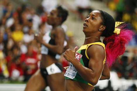 Shelly-Ann Fraser-Pryce of Jamaica runs ahead of Murielle Ahoure of the Ivory Coast (L) to win the women's 200 metres final during the IAAF Shelly-Ann Fraser-Pryce of Jamaica runs ahead of Murielle Ahoure of the Ivory Coast (L) to win the women's 200 metres final during the IAAF