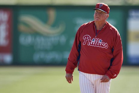Philadelphia Phillies manager Charlie Manuel watches his players during a workout before a MLB spring training baseball game with the Toront Philadelphia Phillies manager Charlie Manuel watches his players during a workout before a MLB spring training baseball game with the Toront