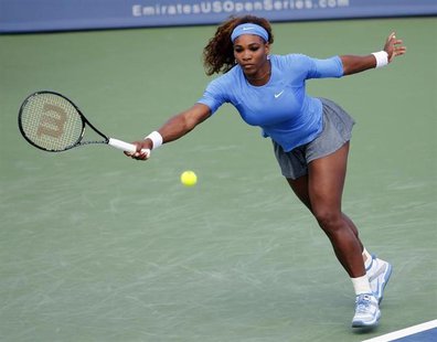 Serena Williams of the U.S. hits a return ball to Simona Halep of Romania in their quarterfinal round match at the Women's Cincinnati Open t Serena Williams of the U.S. hits a return ball to Simona Halep of Romania in their quarterfinal round match at the Women's Cincinnati Open t