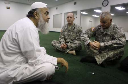 Imam Syed Ahmed Ali (L-R), Chaplain Jason Palmer, and Chaplain Ira Houck sit together at the Islamic Community Center in Killeen, Texas November 7, 2009. REUTERS/Jessica Rinaldi Imam Syed Ahmed Ali (L-R), Chaplain Jason Palmer, and Chaplain Ira Houck sit together at the Islamic Community Center in Killeen, Texas November 7, 2009. REUTERS/Jessica Rinaldi