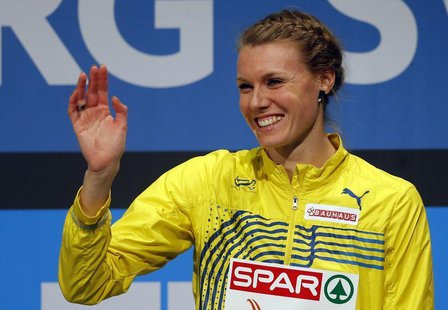 Third placed Emma Green Tregaro of Sweden shows her medal on the podium after the women's High Jump event at the European Athletics Indoor C Third placed Emma Green Tregaro of Sweden shows her medal on the podium after the women's High Jump event at the European Athletics Indoor C
