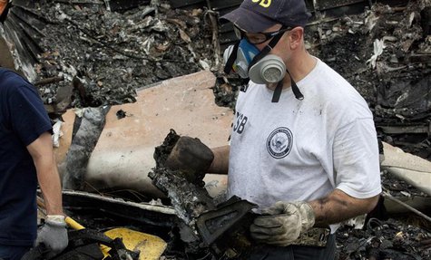 National Transportation Safety Board (NTSB) investigators retrieve the flight voice and data recorders from the wreckage of UPS flight 1354 National Transportation Safety Board (NTSB) investigators retrieve the flight voice and data recorders from the wreckage of UPS flight 1354