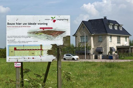 A weathered wooden sign advertising new luxury housing is seen in Lansingerland August 14, 2012. REUTERS/Michael Kooren A weathered wooden sign advertising new luxury housing is seen in Lansingerland August 14, 2012. REUTERS/Michael Kooren