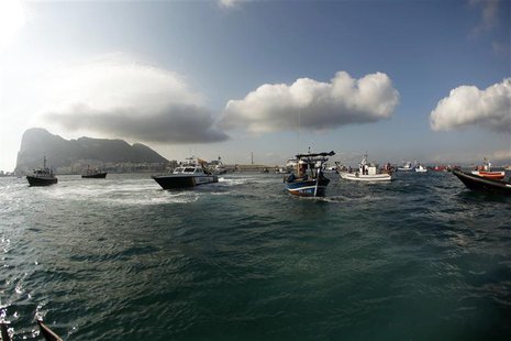 Gibraltarian police (L-2nd L) and the Spanish Civil Guard (3rd L) in their boats, work together to monitor a protest by Spanish fishermen in Gibraltarian police (L-2nd L) and the Spanish Civil Guard (3rd L) in their boats, work together to monitor a protest by Spanish fishermen in