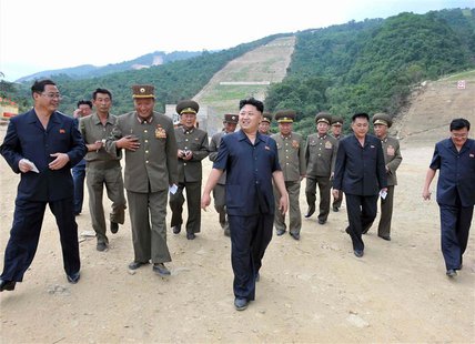 North Korea's leader Kim Jong-un (front C) visits the construction site of a ski resort being built on Masik Pass in this undated photo rele North Korea's leader Kim Jong-un (front C) visits the construction site of a ski resort being built on Masik Pass in this undated photo rele
