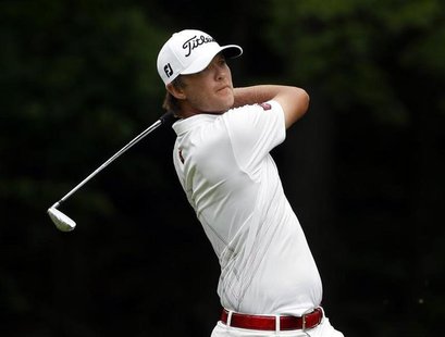 Matt Jones of Australia watches his second shot on the 15th hole during the third round of the Memorial Tournament at Muirfield Village Golf Matt Jones of Australia watches his second shot on the 15th hole during the third round of the Memorial Tournament at Muirfield Village Golf