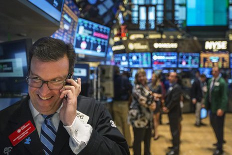 A trader works on the floor of the New York Stock Exchange shortly before the end of the day's trading in New York July 31, 2013. REUTERS/Lu A trader works on the floor of the New York Stock Exchange shortly before the end of the day's trading in New York July 31, 2013. REUTERS/Lu