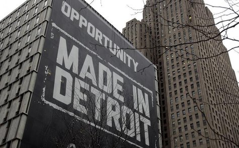 A large "Opportunity Made In Detroit" banner is seen on the side of one of the buildings owned by Quicken Loans founder Dan Gilbert in downt A large "Opportunity Made In Detroit" banner is seen on the side of one of the buildings owned by Quicken Loans founder Dan Gilbert in downt