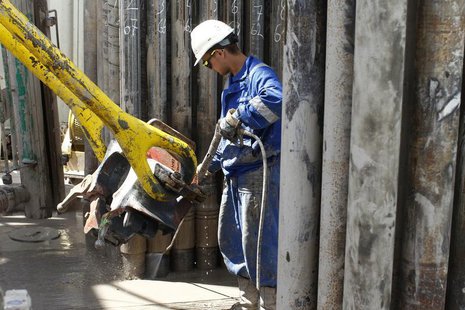 A worker hoses down drilling equipment with water at a shale gas fracking facility run by Poland's PKN Orlen Company on the outskirts of the A worker hoses down drilling equipment with water at a shale gas fracking facility run by Poland's PKN Orlen Company on the outskirts of the