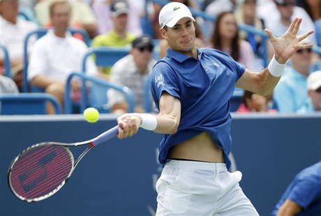 John Isner of the U.S. hits a return ball to Rafael Nadal of Spain during their championship match at the Men's Cincinnati Open tennis tourn John Isner of the U.S. hits a return ball to Rafael Nadal of Spain during their championship match at the Men's Cincinnati Open tennis tourn