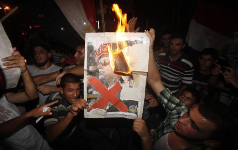 Palestinians burn a poster of Egypt's army chief General Abdel Fattah al-Sisi during a rally in support of Egypt's deposed Islamist Presiden Palestinians burn a poster of Egypt's army chief General Abdel Fattah al-Sisi during a rally in support of Egypt's deposed Islamist Presiden