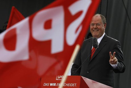Peer Steinbrueck, the Social Democratic party (SPD) candidate in the upcoming general elections, gestures while delivering a speech at his p Peer Steinbrueck, the Social Democratic party (SPD) candidate in the upcoming general elections, gestures while delivering a speech at his p