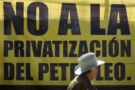 An activist stands in front a banner during a political meeting organized by Party of the Democratic Revolution (PRD) to present a proposal An activist stands in front a banner during a political meeting organized by Party of the Democratic Revolution (PRD) to present a proposal