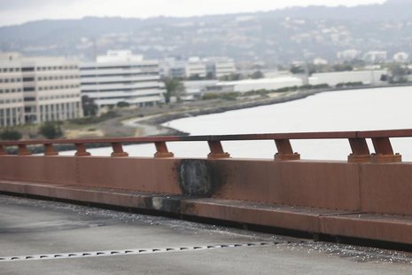 Burn marks left on the railing on San Mateo-Hayward Bridge are pictured on the morning after a fatal limousine fire in Foster City, Californ Burn marks left on the railing on San Mateo-Hayward Bridge are pictured on the morning after a fatal limousine fire in Foster City, Californ