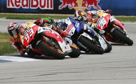 Honda MotoGP rider Marc Marquez (93) leads Yamaha rider Jorge Lorenzo (99) and Honda rider Dani Pedrosa, all of Spain, during the Indianapol Honda MotoGP rider Marc Marquez (93) leads Yamaha rider Jorge Lorenzo (99) and Honda rider Dani Pedrosa, all of Spain, during the Indianapol