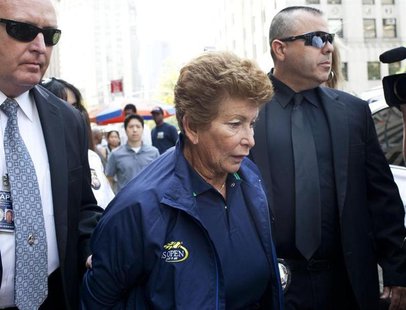 Lois Ann Goodman, 70, is led away from the Manhattan Criminal Court after being extradited to California in the custody of Los Angeles Polic Lois Ann Goodman, 70, is led away from the Manhattan Criminal Court after being extradited to California in the custody of Los Angeles Polic