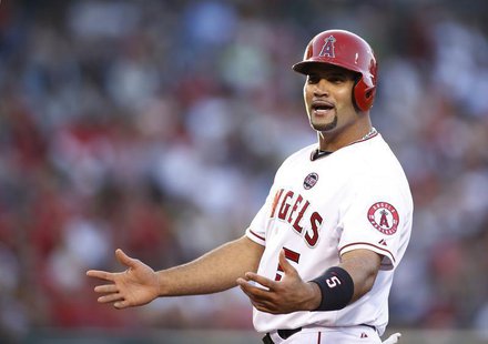 Los Angeles Angels' Albert Pujols gestures towards the New York Yankees dugout after hitting a single during the first inning of their MLB A Los Angeles Angels' Albert Pujols gestures towards the New York Yankees dugout after hitting a single during the first inning of their MLB A