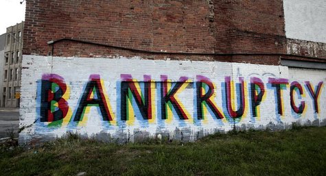The word 'Bankruptcy' is seen painted on the side of a vacant building by street artists as a statement on the financial affairs of the city The word 'Bankruptcy' is seen painted on the side of a vacant building by street artists as a statement on the financial affairs of the city