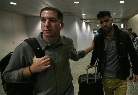 U.S. journalist Glenn Greenwald (L) walks with his partner David Miranda in Rio de Janeiro's International Airport August 19, 2013. REUTERS/ U.S. journalist Glenn Greenwald (L) walks with his partner David Miranda in Rio de Janeiro's International Airport August 19, 2013. REUTERS/