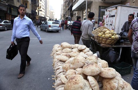 A man walks past a bread stand at a street corner in central Cairo April 11, 2013. REUTERS/Asmaa Waguih A man walks past a bread stand at a street corner in central Cairo April 11, 2013. REUTERS/Asmaa Waguih