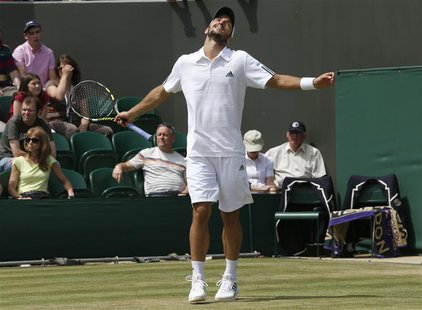 Viktor Troicki of Serbia reacts after losing advantage in his men's singles tennis match against Mikhail Youzhny of Russia at the Wimbledon Viktor Troicki of Serbia reacts after losing advantage in his men's singles tennis match against Mikhail Youzhny of Russia at the Wimbledon