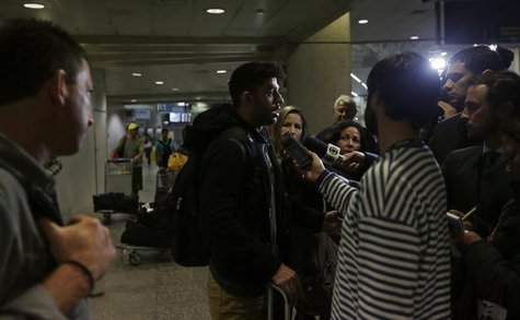 David Miranda (2nd L), partner of U.S. journalist Glenn Greenwald (L), speaks to the media at Rio de Janeiro's International Airport August David Miranda (2nd L), partner of U.S. journalist Glenn Greenwald (L), speaks to the media at Rio de Janeiro's International Airport August