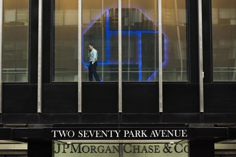 A man talks on his phone while pacing inside of the headquarters of JPMorgan Chase & Co bank in New York, March 15, 2013. REUTERS/Lucas Jack A man talks on his phone while pacing inside of the headquarters of JPMorgan Chase & Co bank in New York, March 15, 2013. REUTERS/Lucas Jack