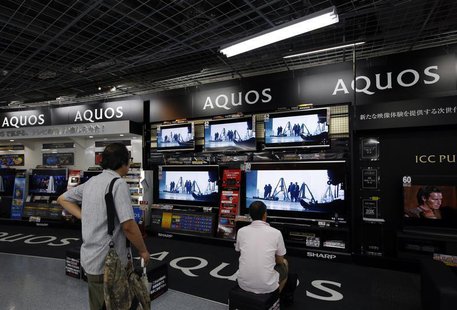Customers look at Sharp Corp Aquos television sets displayed at an electronics store in Tokyo August 1, 2013. REUTERS/Issei Kato Customers look at Sharp Corp Aquos television sets displayed at an electronics store in Tokyo August 1, 2013. REUTERS/Issei Kato