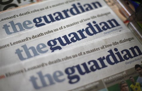 Copies of the Guardian newspaper are displayed at a news agent in London August 21, 2013. REUTERS/Suzanne Plunkett Copies of the Guardian newspaper are displayed at a news agent in London August 21, 2013. REUTERS/Suzanne Plunkett