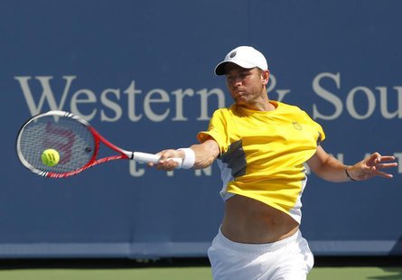 Mardy Fish of the U.S. hits a return to Germany's Philipp Kohlschreiber during their first round match at the men's Cincinnati Open tennis t Mardy Fish of the U.S. hits a return to Germany's Philipp Kohlschreiber during their first round match at the men's Cincinnati Open tennis t