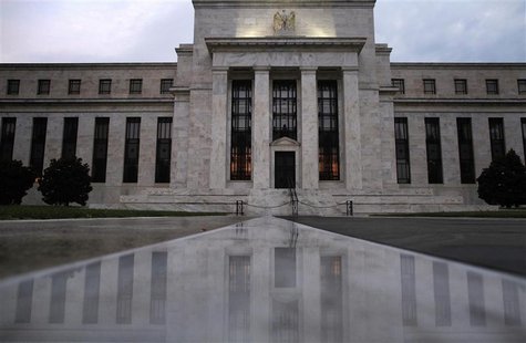 The facade of the U.S. Federal Reserve building is reflected on wet marble during the early morning hours in Washington, July 31, 2013. REUT The facade of the U.S. Federal Reserve building is reflected on wet marble during the early morning hours in Washington, July 31, 2013. REUT