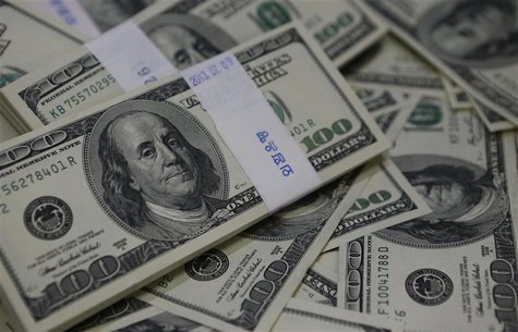 U.S. one-hundred dollar bills are seen in this photo illustration at a bank in Seoul August 2, 2013. REUTERS/Kim Hong-Ji U.S. one-hundred dollar bills are seen in this photo illustration at a bank in Seoul August 2, 2013. REUTERS/Kim Hong-Ji